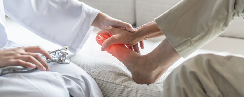 Doctor examining foot pain caused by alcoholic neuropathy in Spokane WA