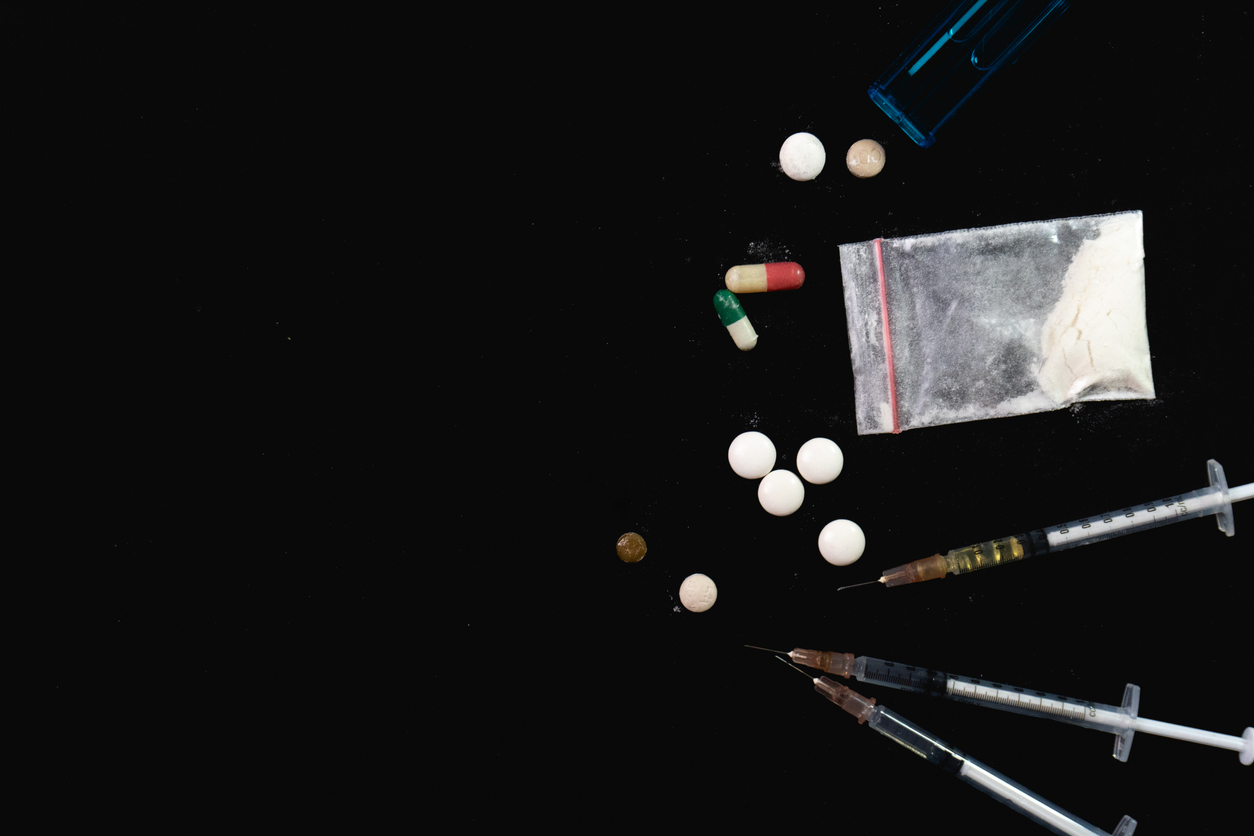 Prescription pill bottles and stethoscope representing medical opiate detox treatment in Spokane WA