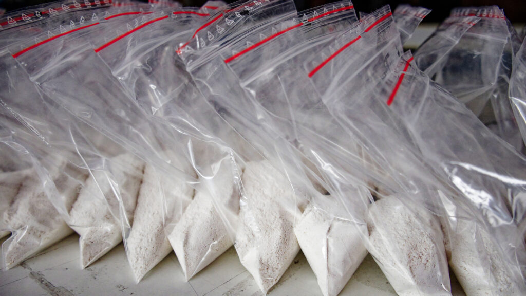 Plastic bags filled with illegal stimulant powder arranged in rows, representing drug trafficking in Spokane WA