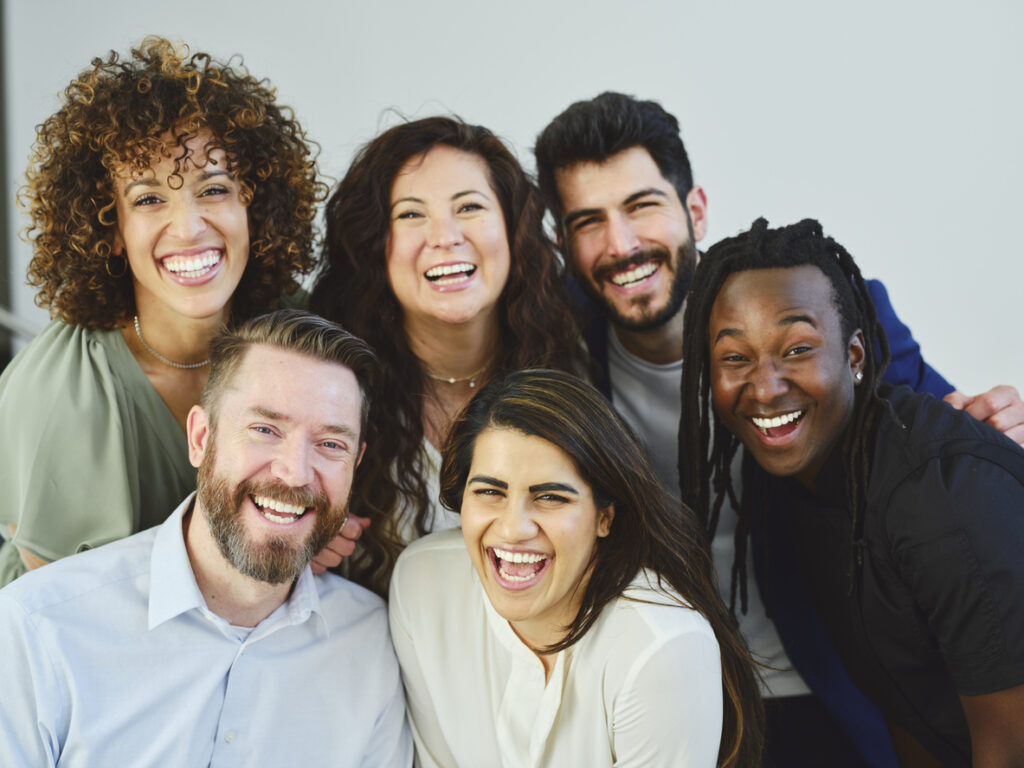 diverse group of smiling friends celebrating healthy living, highlighting what is sobriety community support across Spokane, Washington State (WA) and Spokane Valley