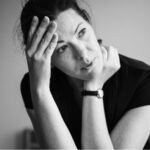 A black and white photo of a woman needing inpatient mental health treatment