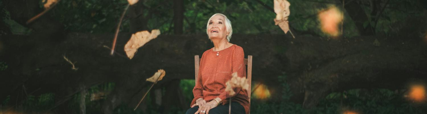 An older woman contemplating the relationship between aging and mental health