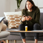 A woman sitting on a sofa