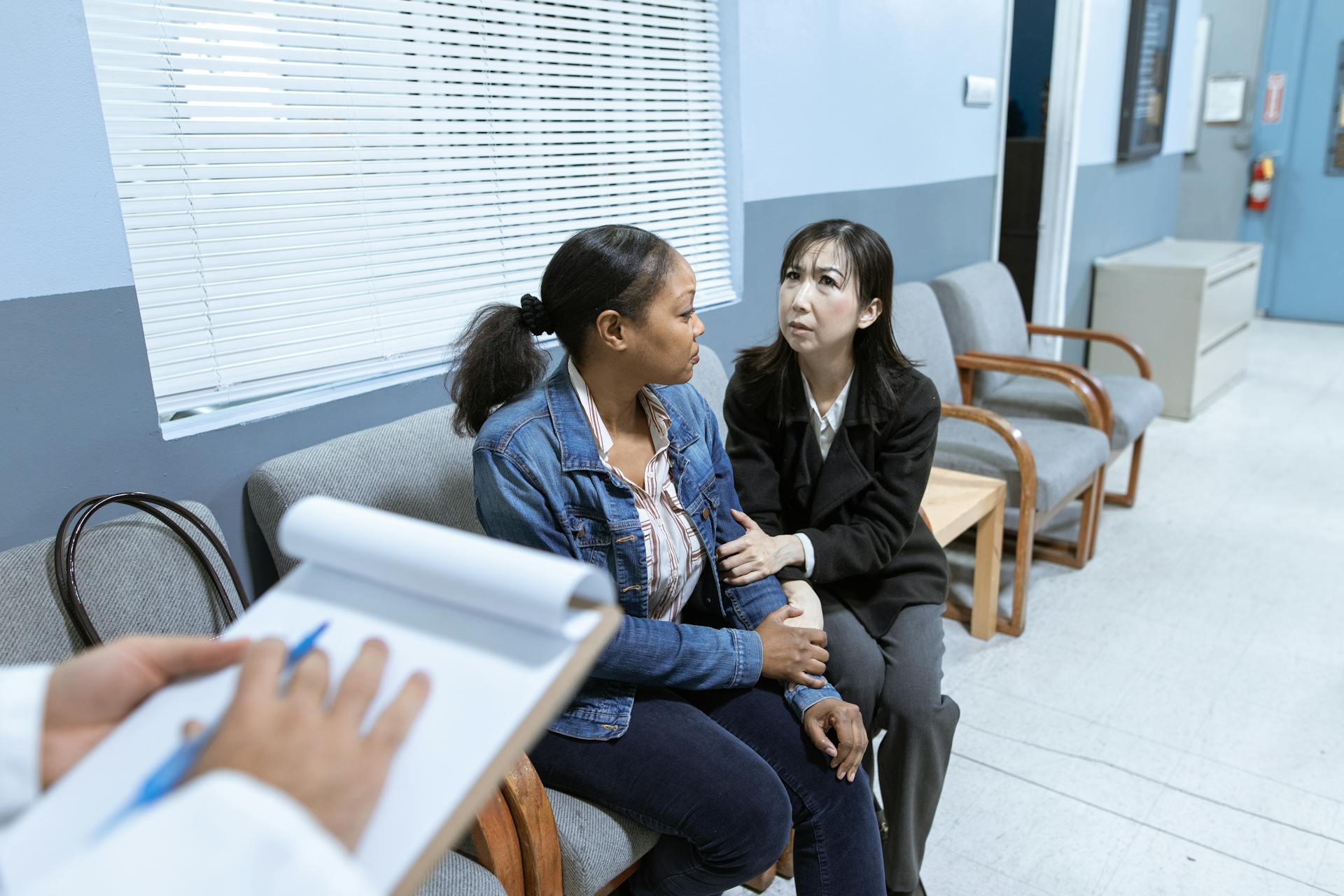Woman providing emotional support to another woman practicing grounding techniques for anxiety in Spokane WA