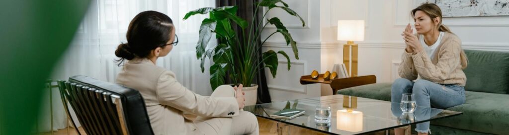 A person talking to a therapist during borderline personality disorder treatment 