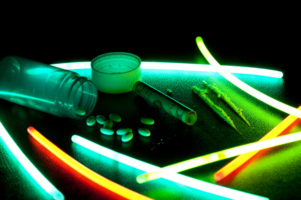 Representation of Dilaudid addiction and drug abuse with neon lights and pills in Spokane Valley WA