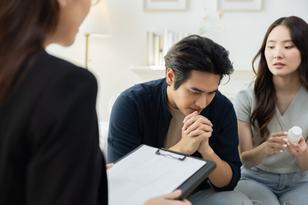 husband wife with therapist regarding his crippling anxiety disorder