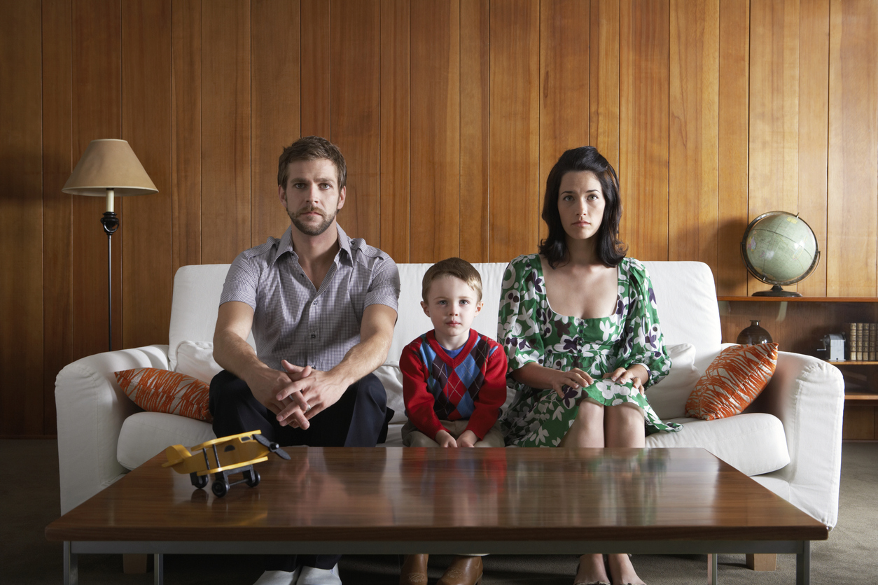 narcissistic parents sitting with son