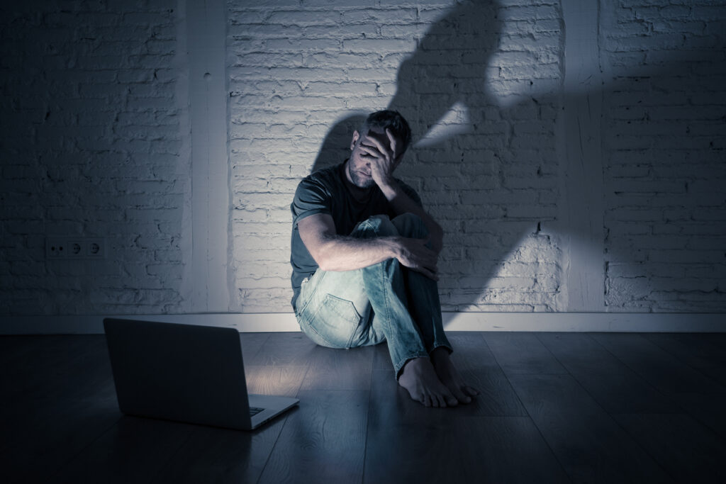 a person sitting in dimly lit area spokane valley washington