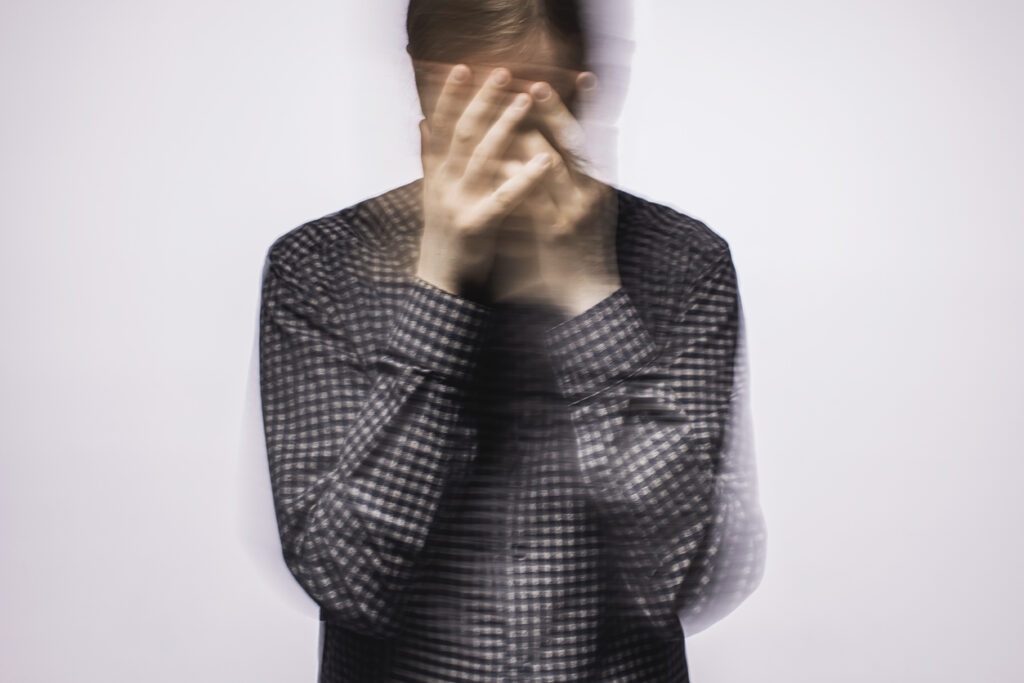 Person experiencing sensory or emotional overwhelm representing ADHD vs autism awareness in Spokane WA