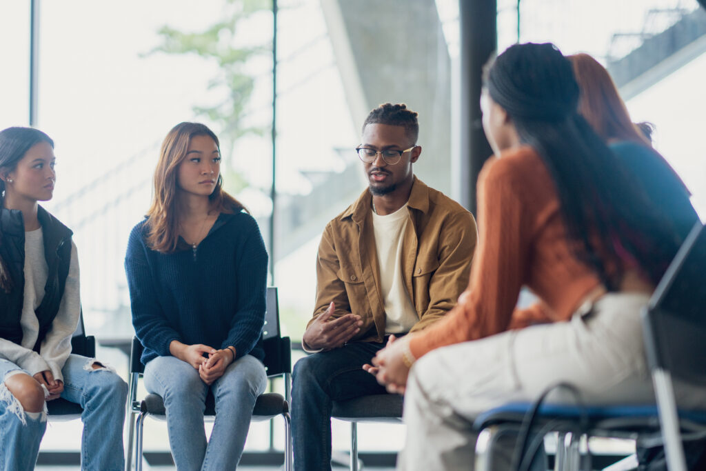 Diverse group of people participating in depression counseling session in Spokane WA
