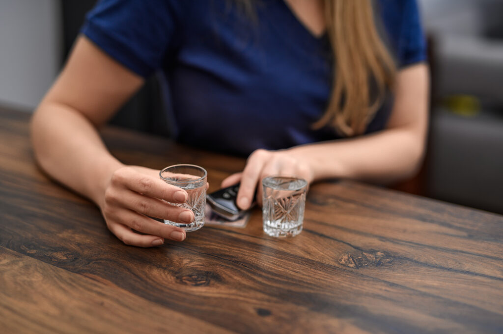 person holding small shot glass spokane valley washington